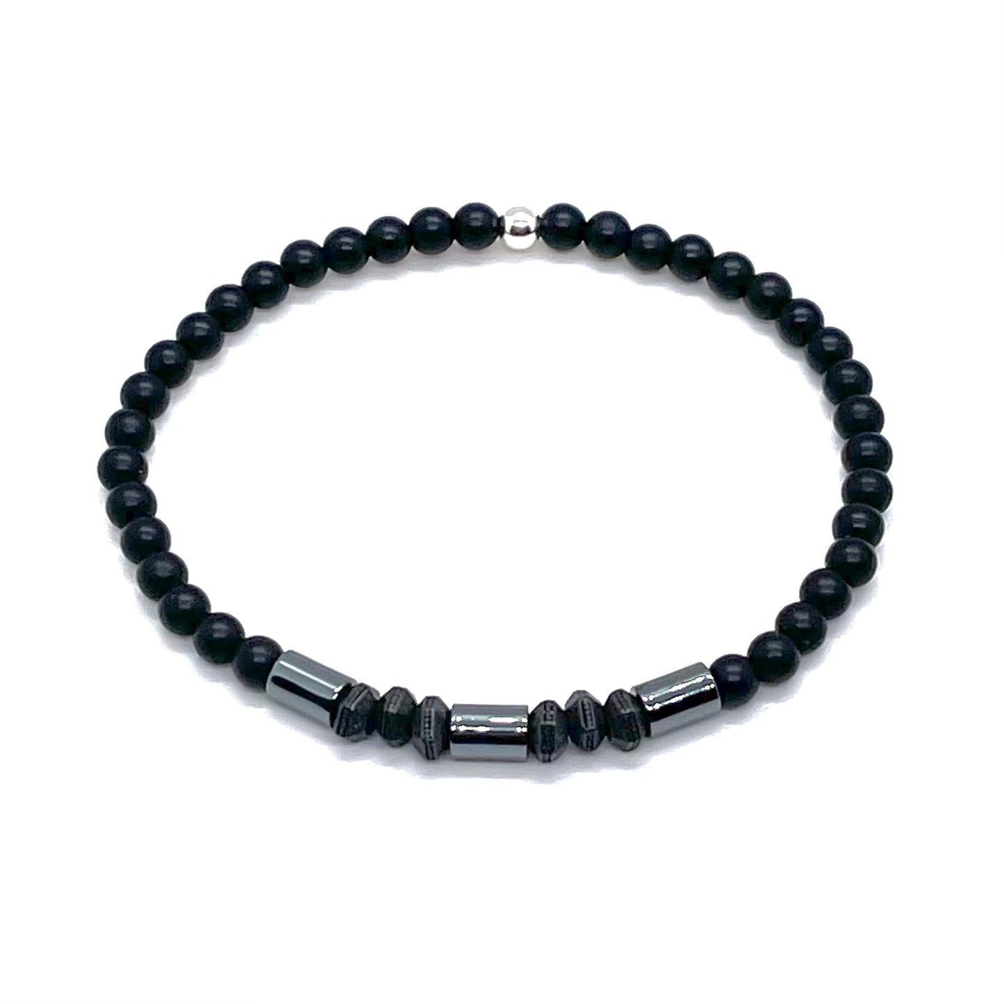 Mens onyx bracelet with black-plated hexagons and hematite cylinders.