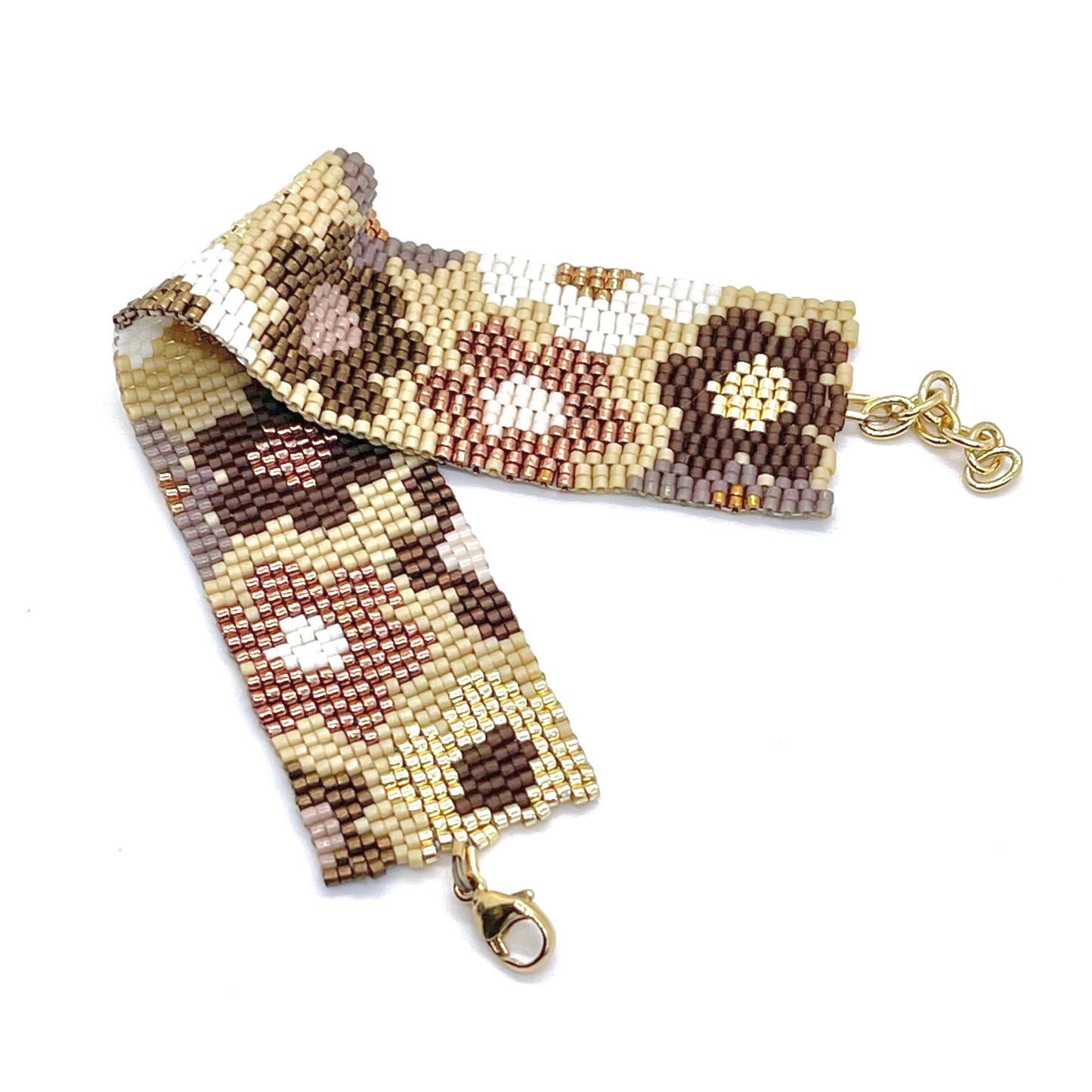 Womans beaded daisy stackable statement bracelet with tiny tan and bronze seed beads in a peyote stitch.