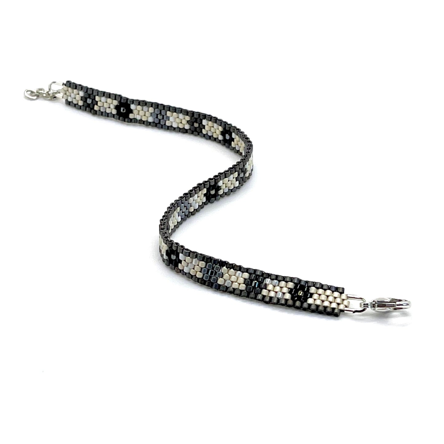 Flower flat seed bead black, gray, and silver peyote stitch bracelet.