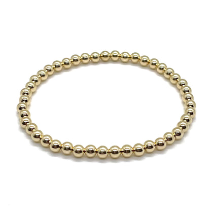 Waterproof gold-filled bracelet with 4mm beads on elastic stretch cord. Tarnish resistant for 24/7 use.