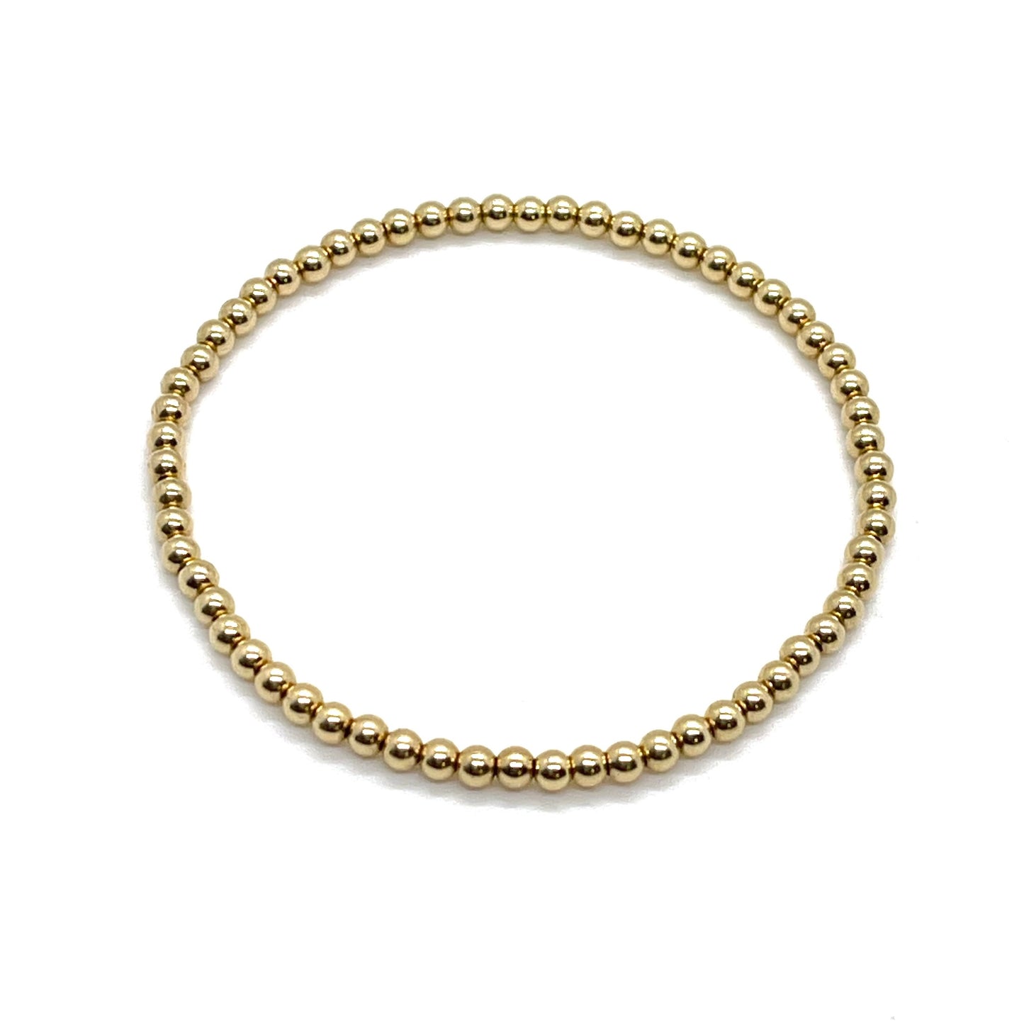 Gold bracelet for women with 3mm waterproof, tarnish-free 14K gold filled beads hand strung on stretch cord. 