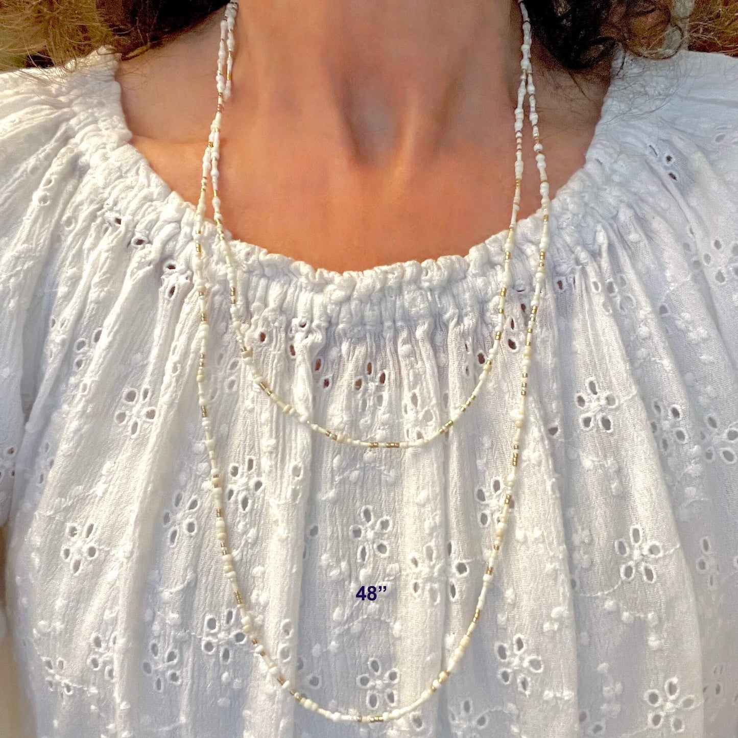 Long, dainty 48" white and gold seed bead wrap necklace on elastic stretch cord..