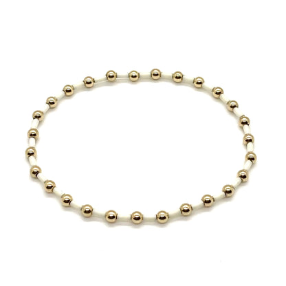 Ivory and gold beaded stretch bracelet for women.