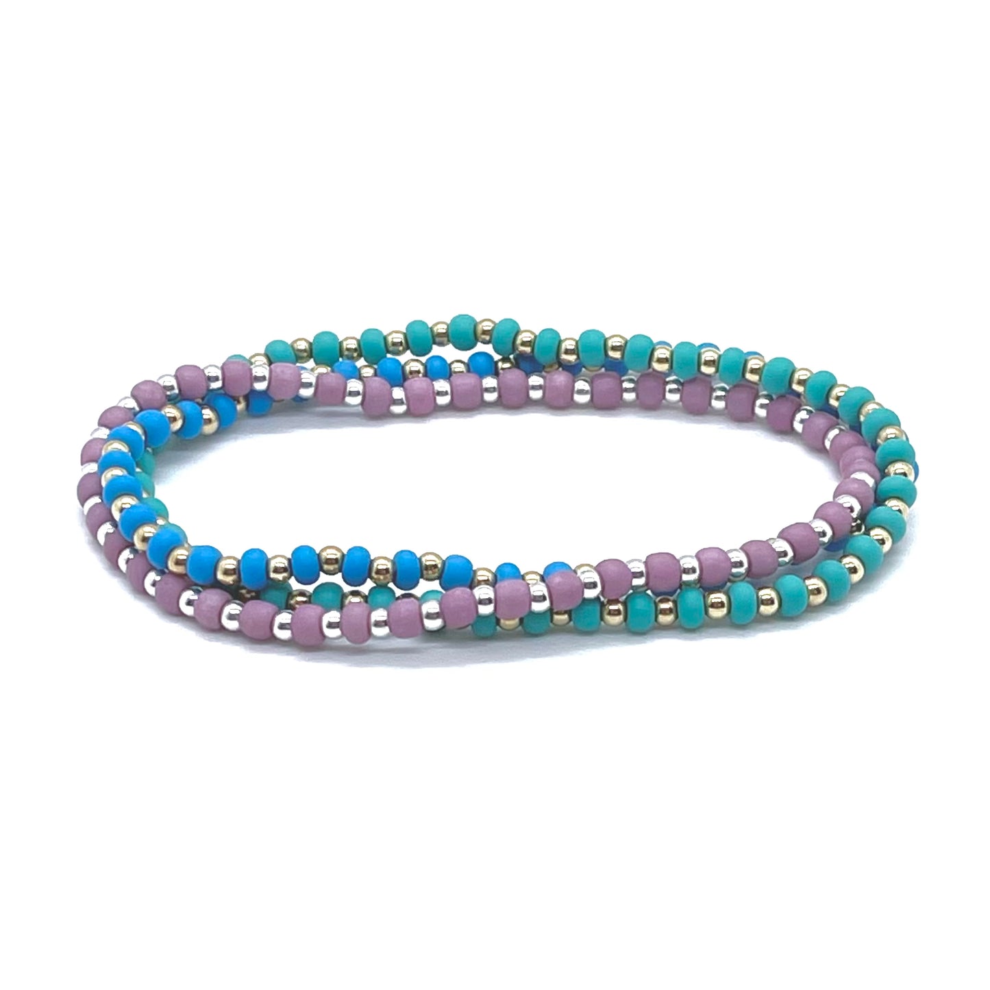 Matte seed bead stretchy anklets with waterproof gold fill and sterling silver 3mm ball beads and mauve, blue and green seed beads.