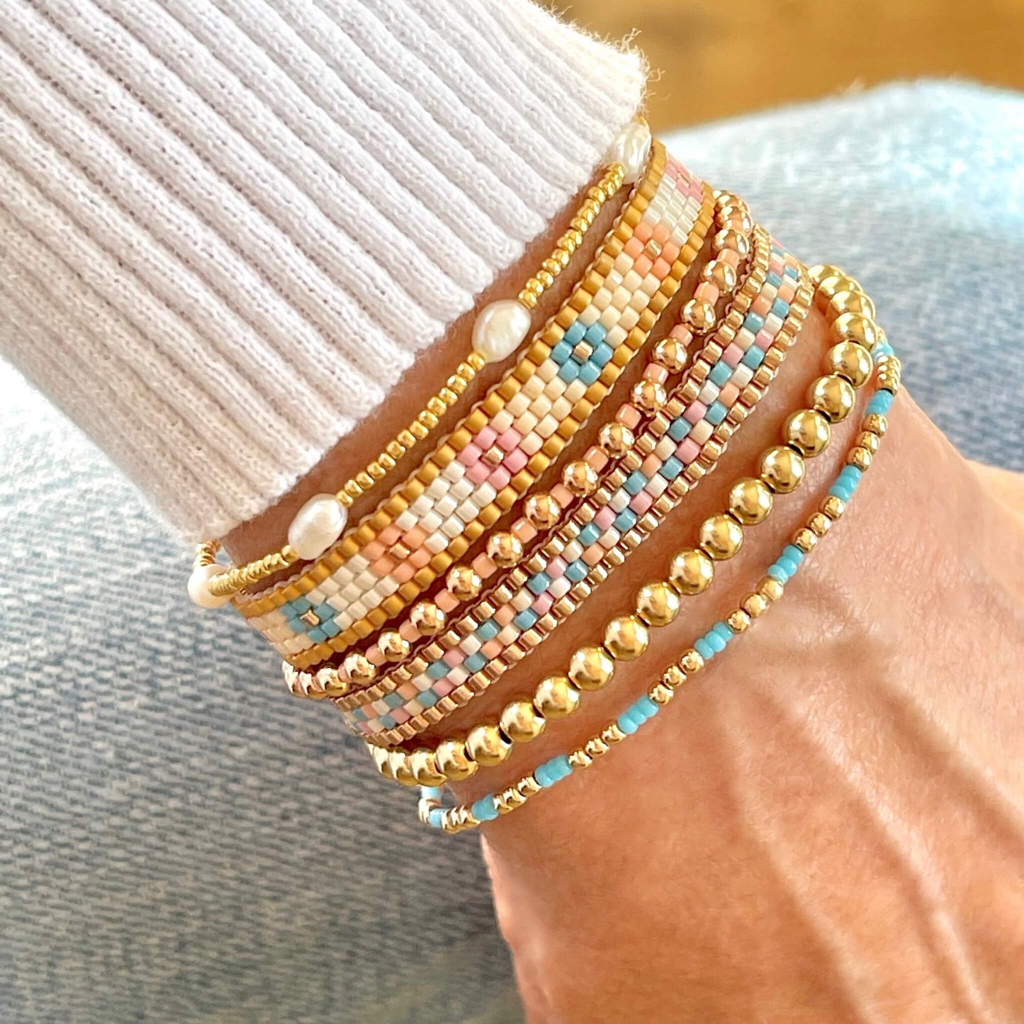 Gold Stretch Bracelets and Flat Beaded Bracelets. Bracelets Stacks & Singles with fresh water pearl bracelets and pastel seed beads.