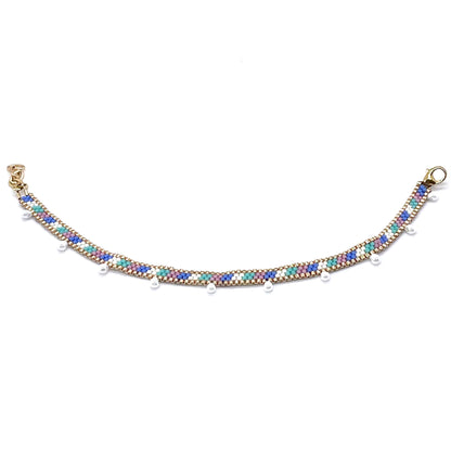 Women's ankle bracelet wtih pastel seed beads in candy stripe pattern and hanging pearl drop beads. Miyuki anklet handmade in NYC.