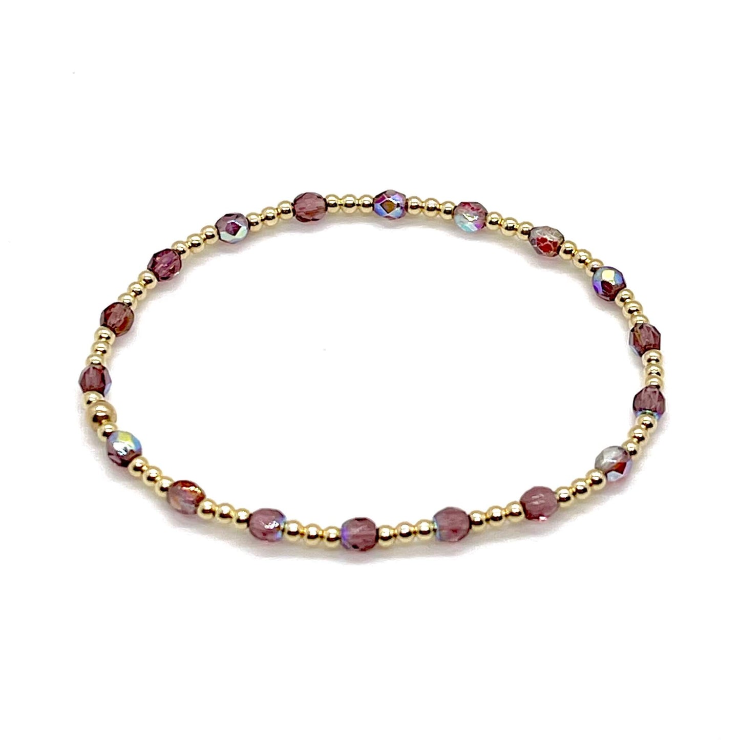 Amethyst crystal bracelet with gold beads for women. Small beaded stretch bracelet handmade in NYC.