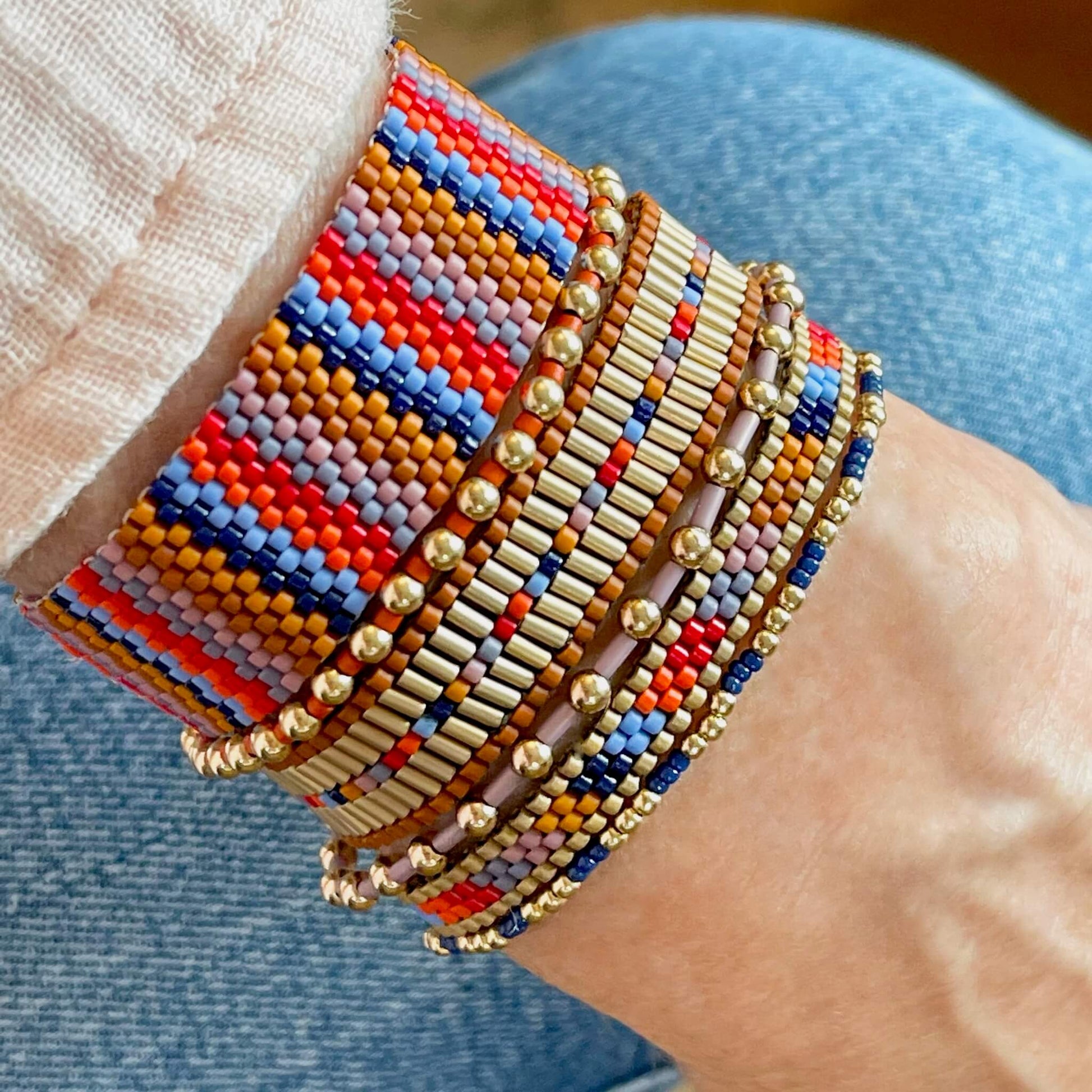 Beaded bracelet stack of 6 woven and stretch bracelets in a southwestern inspired color motif.