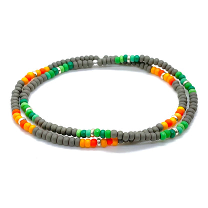 Beaded bracelets for guys with gray beads and green or orange accent beads. Waterproof, stretch bracelets.