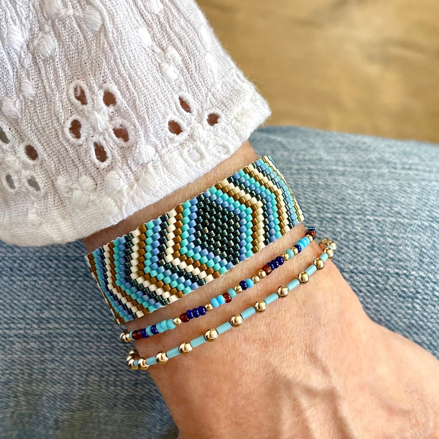 Beaded wide woven and stretch bracelet stack of 3. Handmade with blue, turquoise and brown seed beads and 14K gold filled round beads.