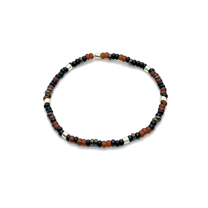 Black and brown men's elastic bracelet with matte and shiny seed beads and brass-plated accent beads.
