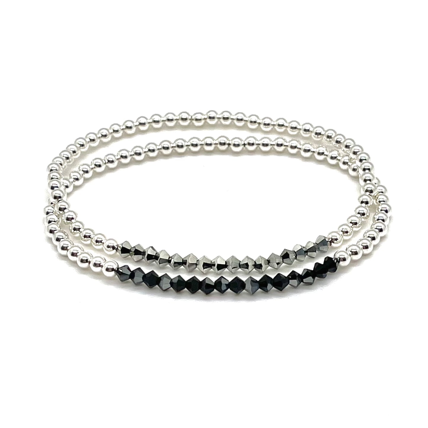 Black and hematite faceted crystal bracelets with sterling silver 3mm beads on stretch cord.