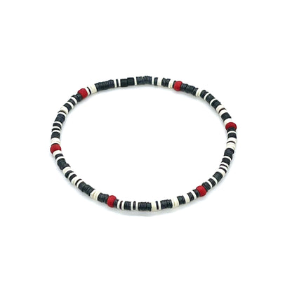 Black and white thin heishi stretch beaded bracelet for guys with red seed bead accents.