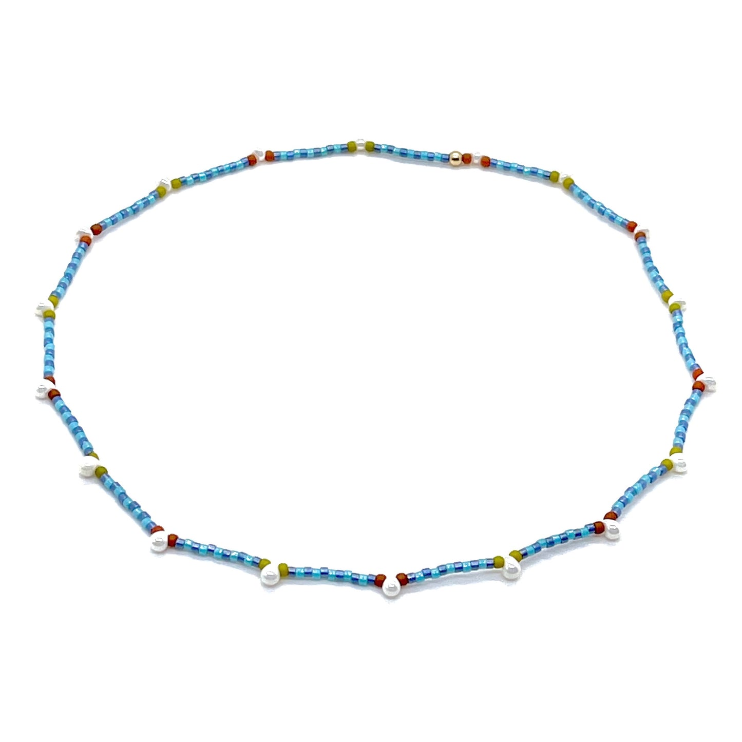 Blue beaded necklace with tiny seed beads and pearl droplets. Handmade on stretch cord.
