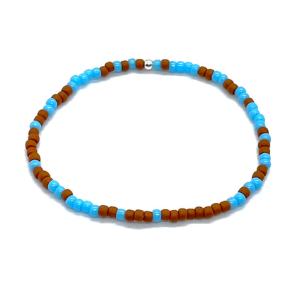 Light blue and brown bracelet for men with tiny seed beads on elastic stretch.