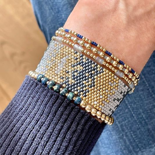 Beaded stretch bracelets with woven beaded bracelet with seed beads in blue ombre and 14k gold fill beads.