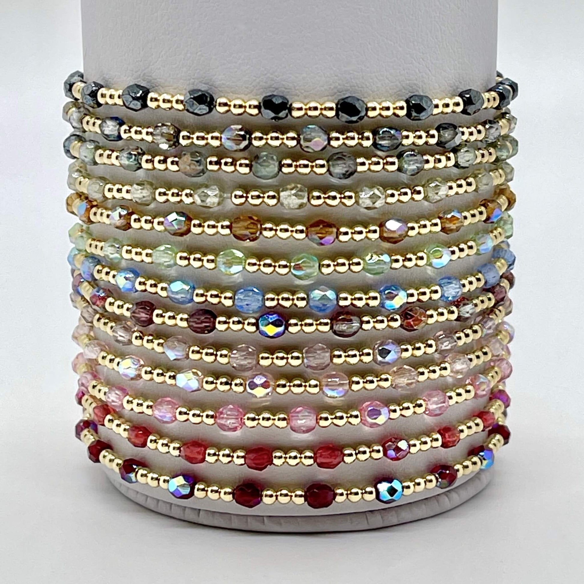 Bracelets with crystal beads and tiny 2mm 14K gold filled beads. A wide range of colors. Dainty womens stretch bracelets.