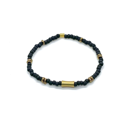 Brass bracelet for men with black seed beads and brass cylinder and nugget beads on elastic stretch cord.