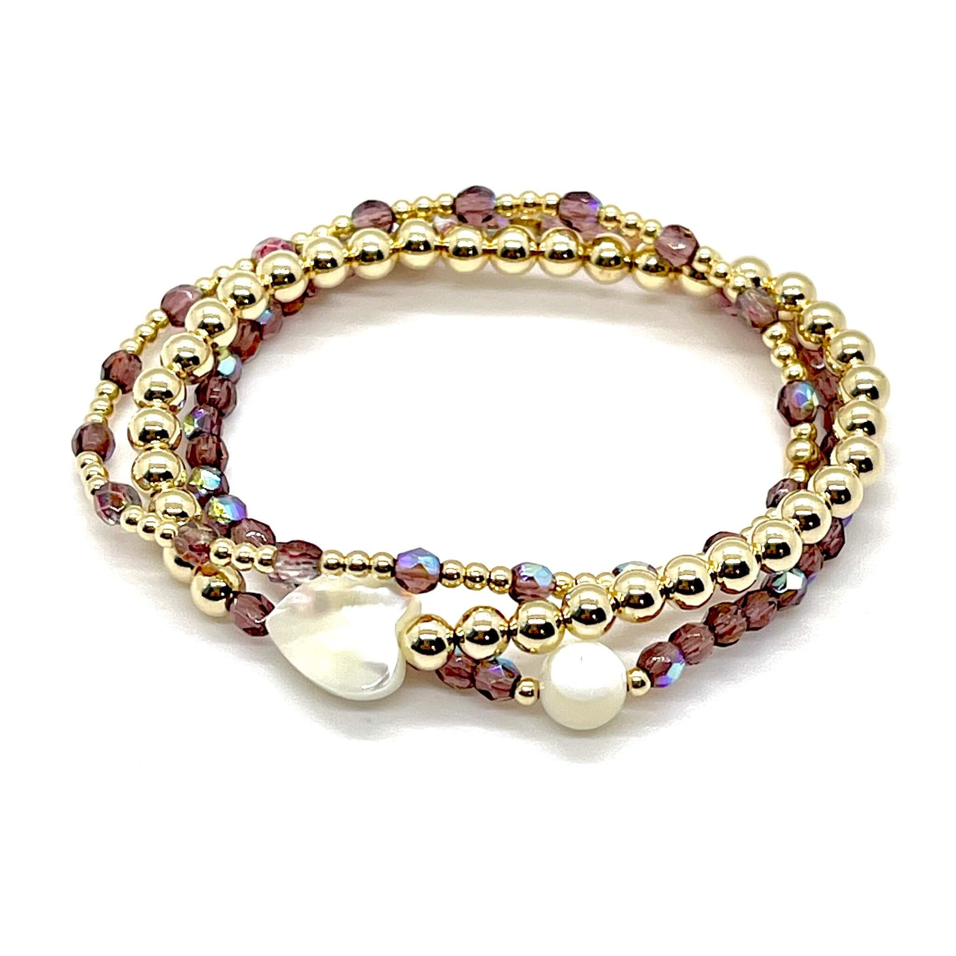 Bridesmaid bracelet gift. Amethyst crystals, 14K gold filled beads, and heart and round mother-of-pearl beads on elastic stretch cord.