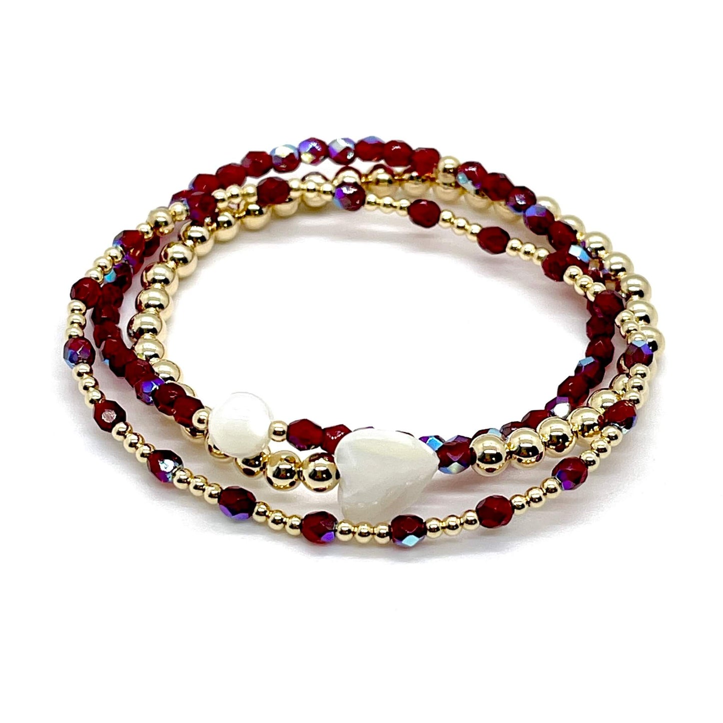Bridesmaid bracelet gift. Garnet red crystals and 14K gold filled beads with mother-of-pearl round and heart shaped accent beads.