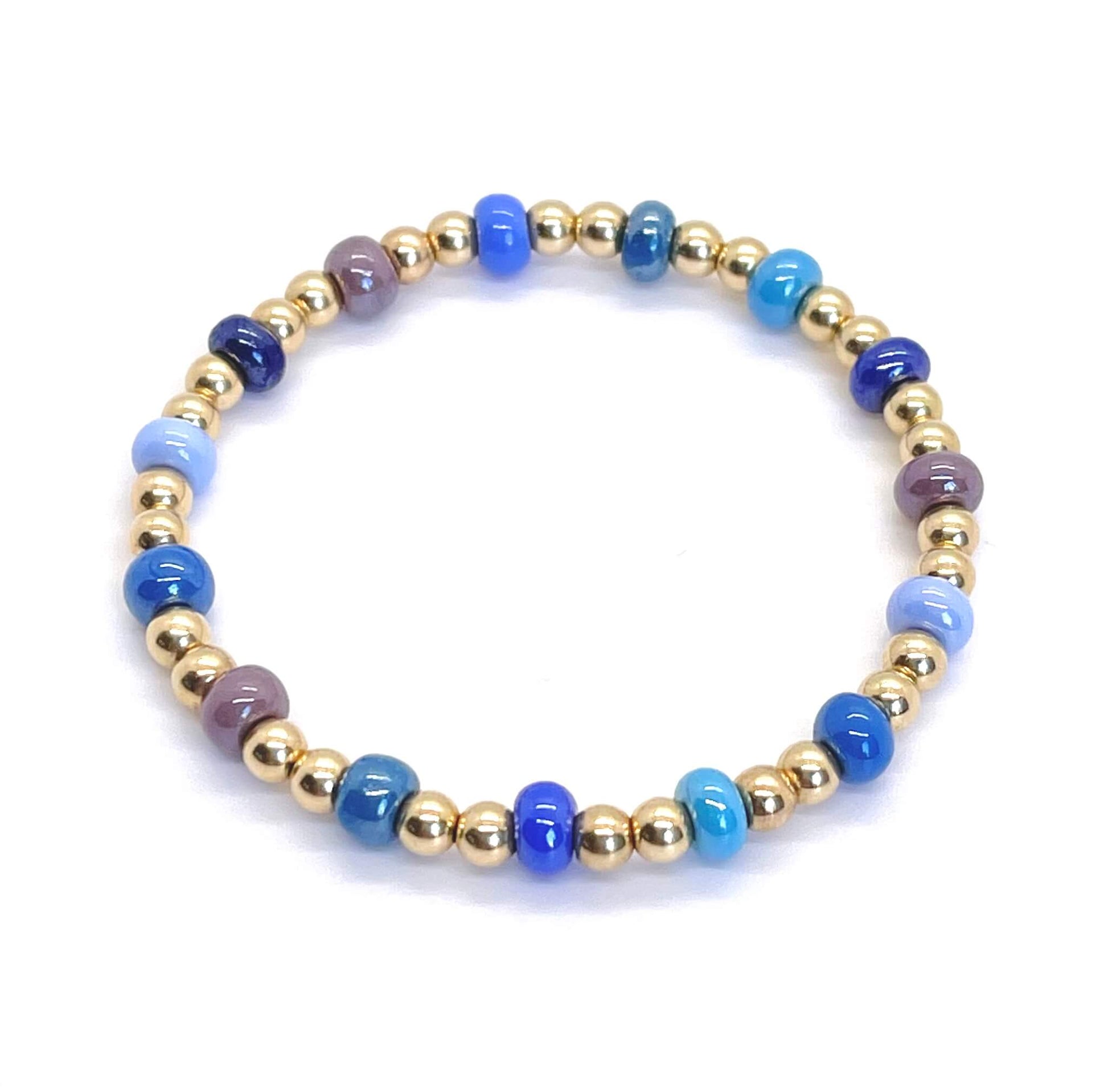 Colorful bracelet with chunky blue glass beads and 4mm gold filled balls on stretch cord.