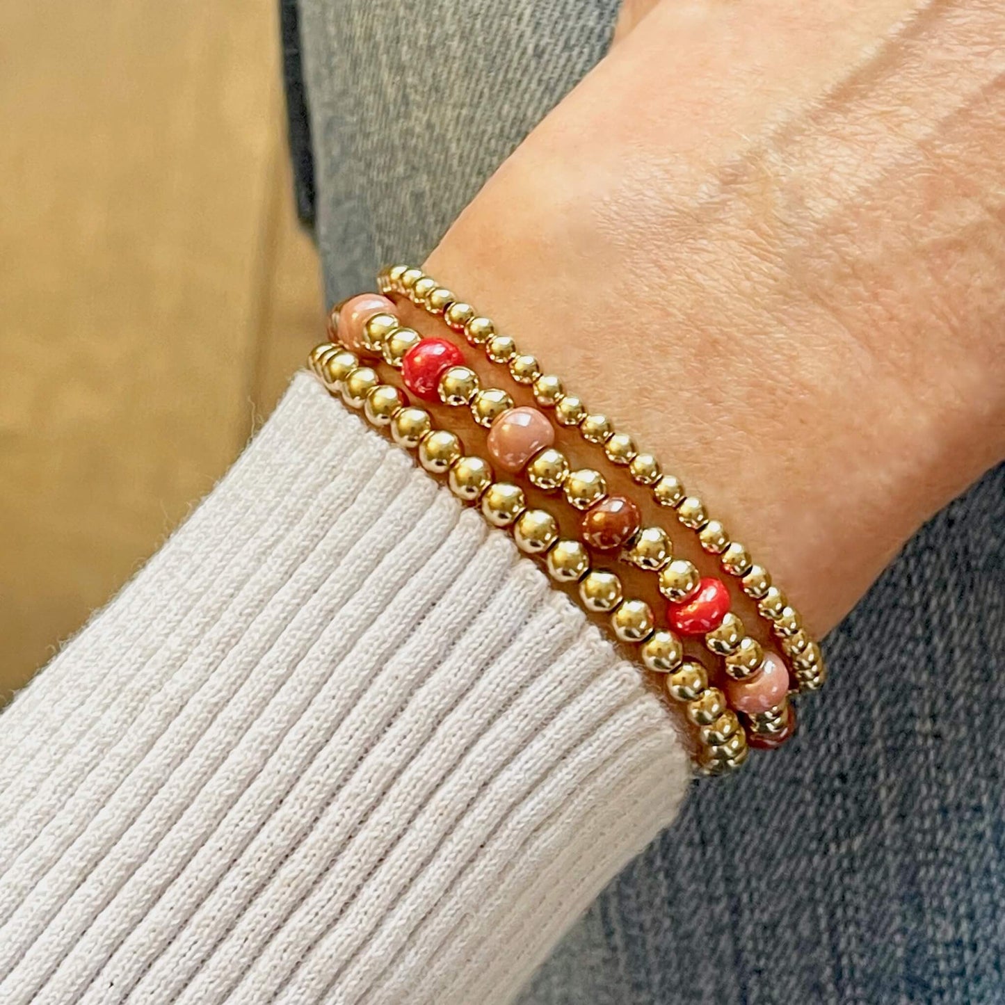 Gold, red, and pink beaded bubble stretch bracelet set of 3.
