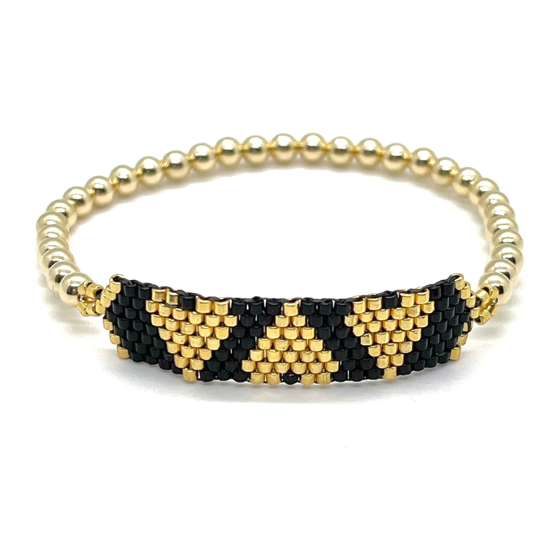 Gold and black woven beaded triple heart band on a 4mm 14K gold-filled ball stretch bracelet. Waterproof and non tarnishing.