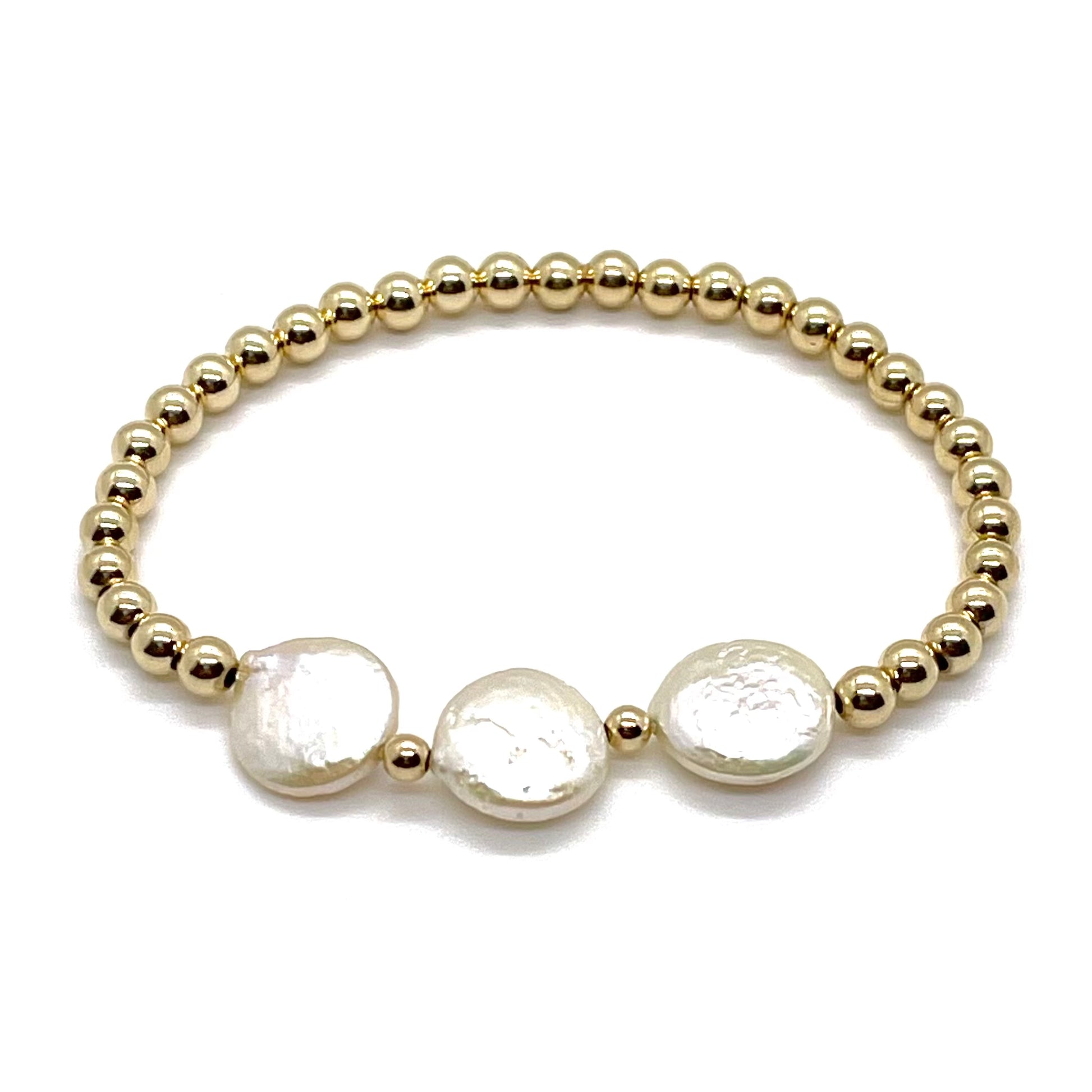 Gold bracelet with freshwater coin pearls and 4mm gold ball beads on elastic stretch cord.