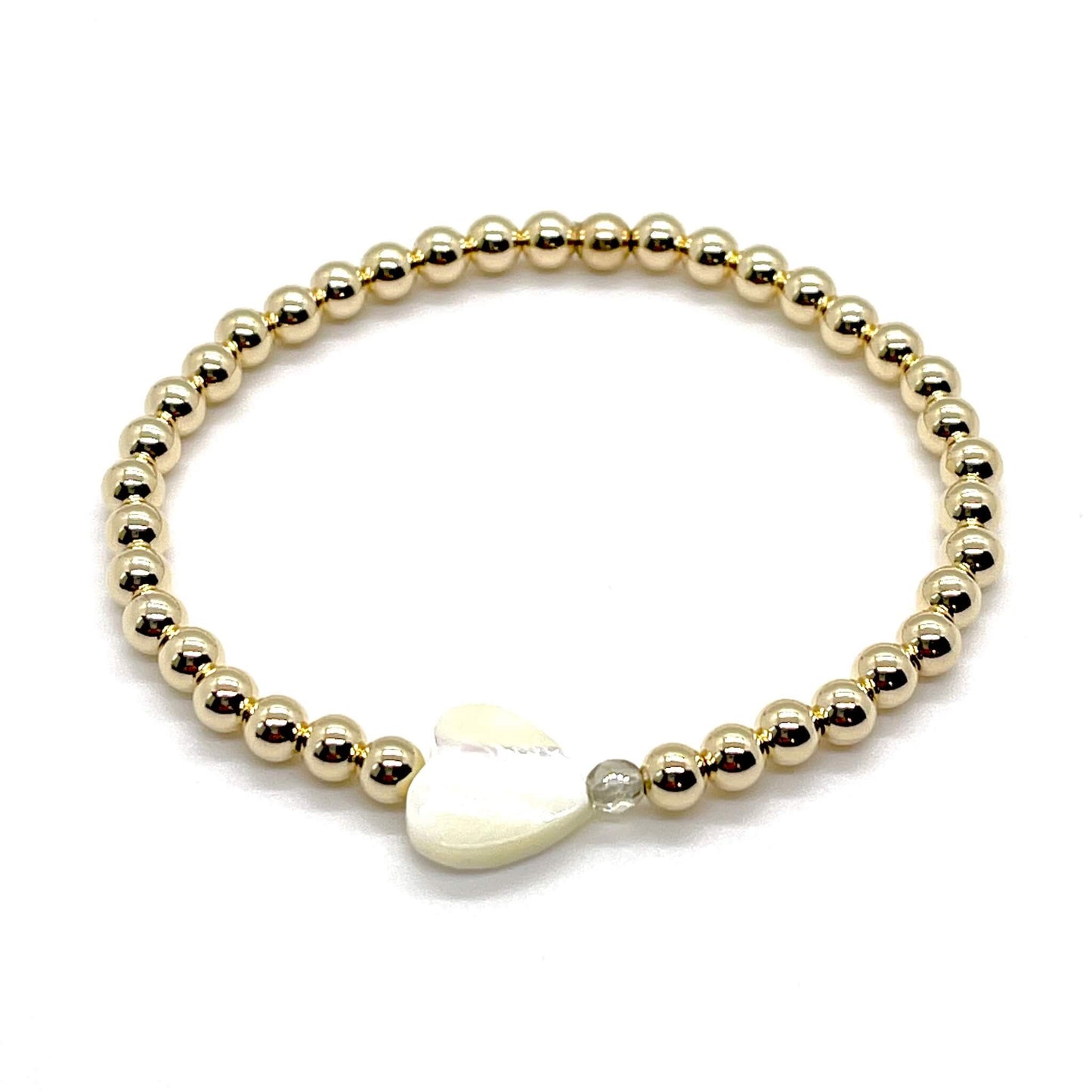 Gold heart bracelet with a mother-of-pearl heart, a small faceted grey-taupe crystal, and 4mm 14K gold filled beads.