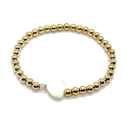 Gold heart bracelet with a mother-of-pearl heart, a small faceted light purple crystal, and 4mm 14K gold filled beads.
