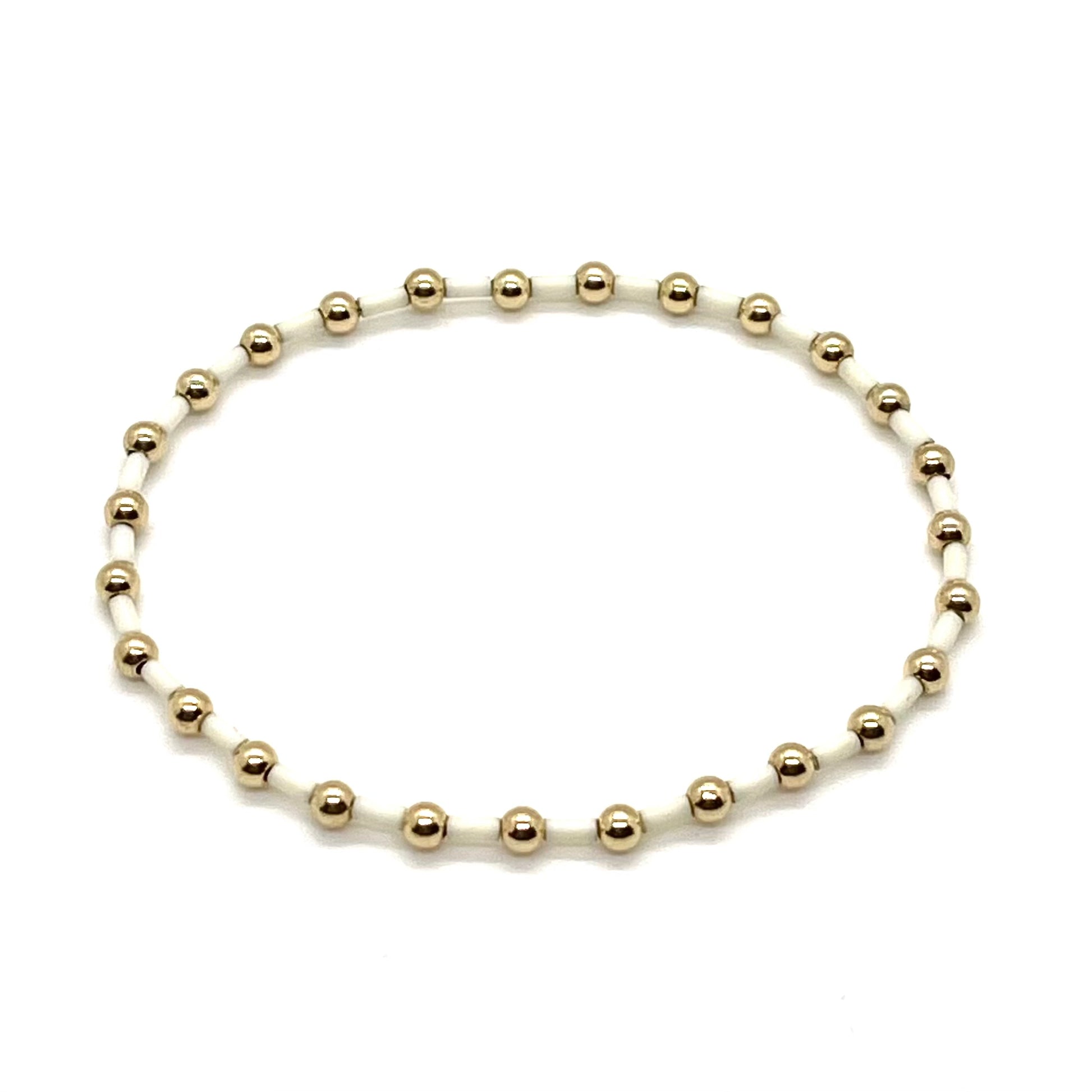 Gold and ivory women's beaded stretch bracelet.
