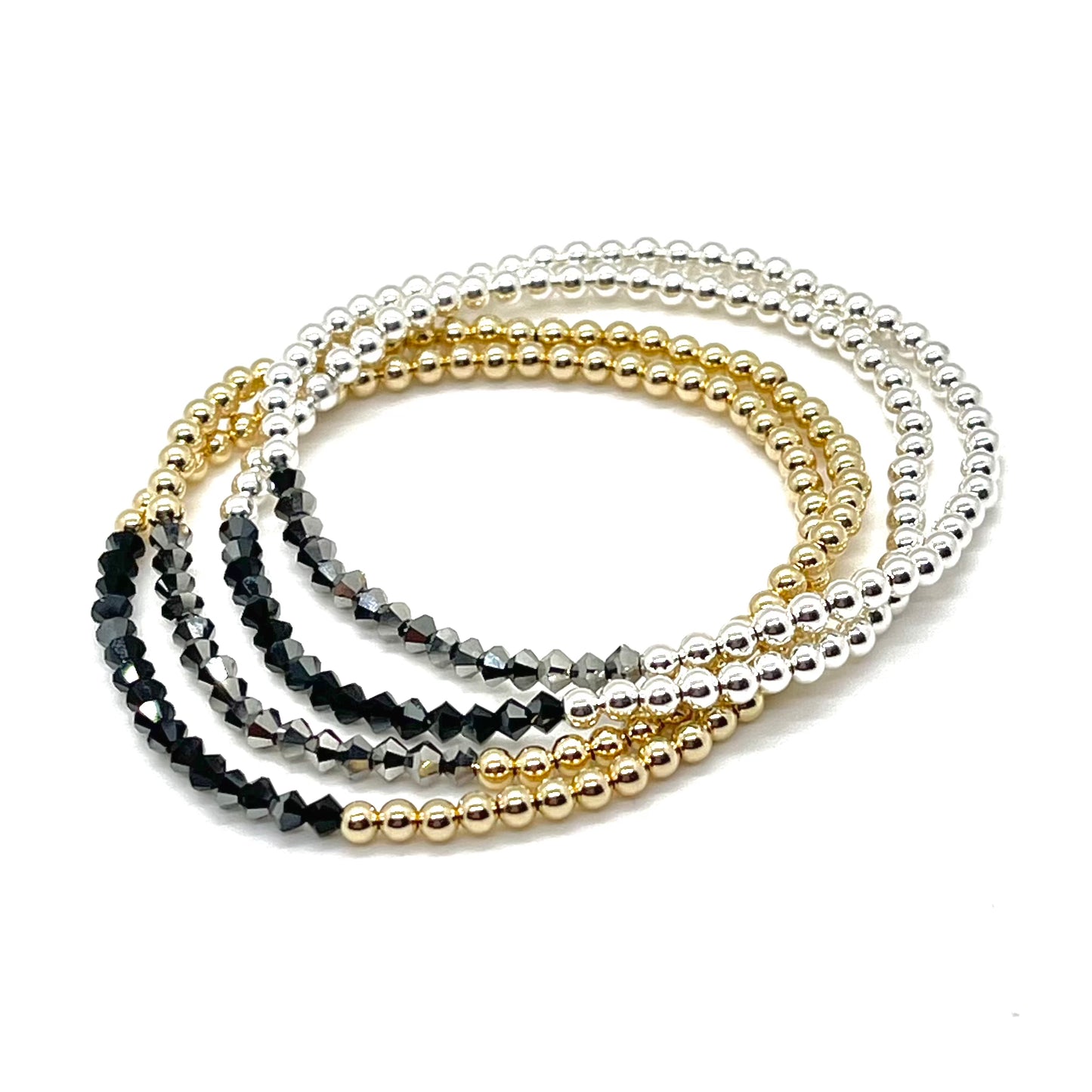 Gold and silver 3mm bead bracelets with black and hematite diamond-shape crystals on stretch cord.
