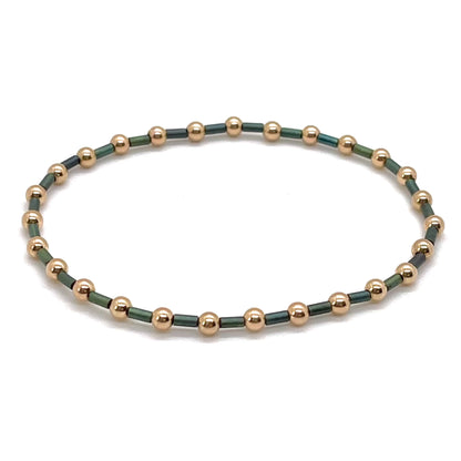 Green bugle bead dainty stretch bracelet with 3mm 14K rose gold filled beads. Waterproof and tarnish resistant.
