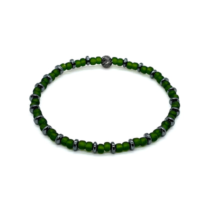 Green men's bracelet with hematite accent disks and matte seed beads on elastic stretch cord.