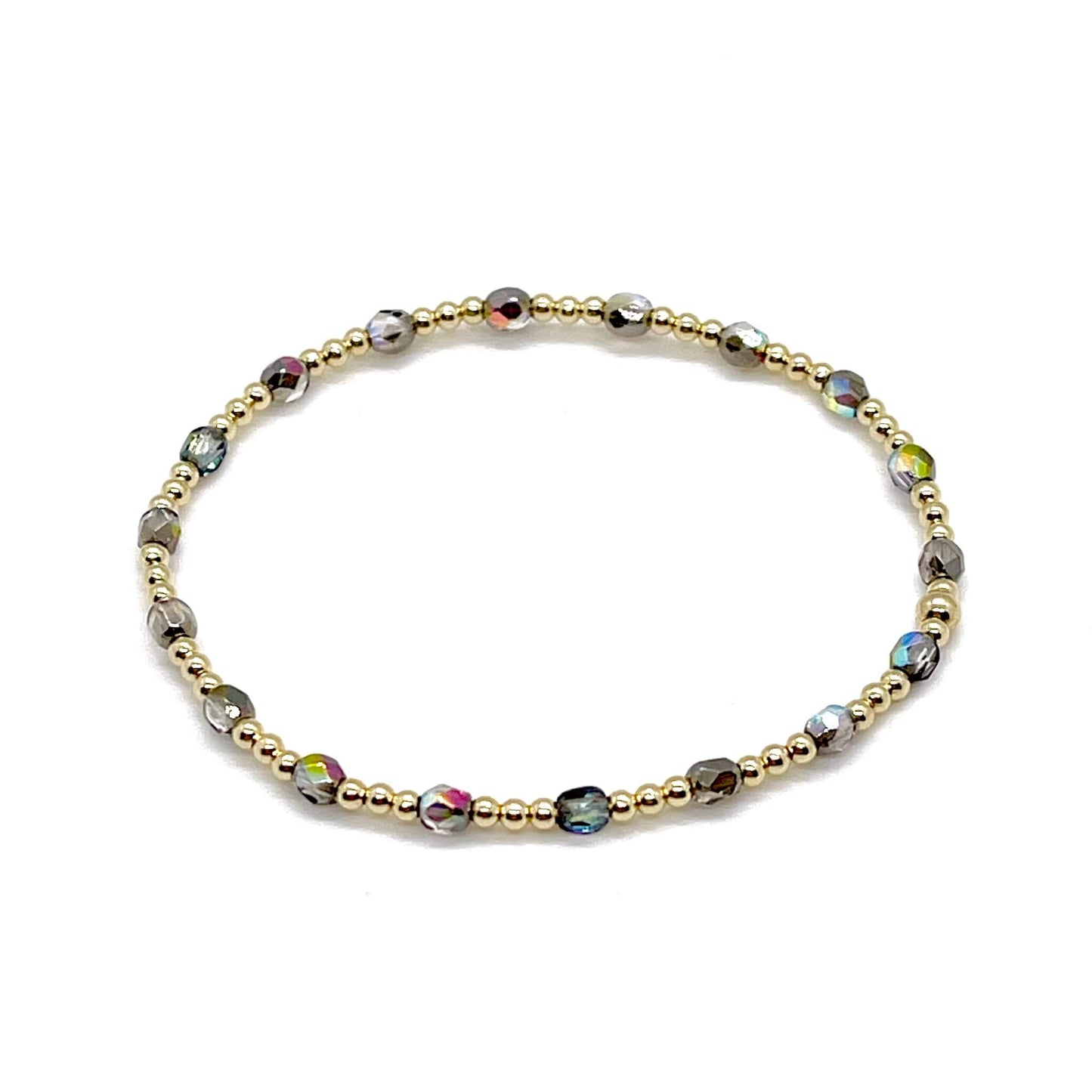 Grey-silver crystal bracelet with dainty 14K gold filled beads on a stretchy cord.