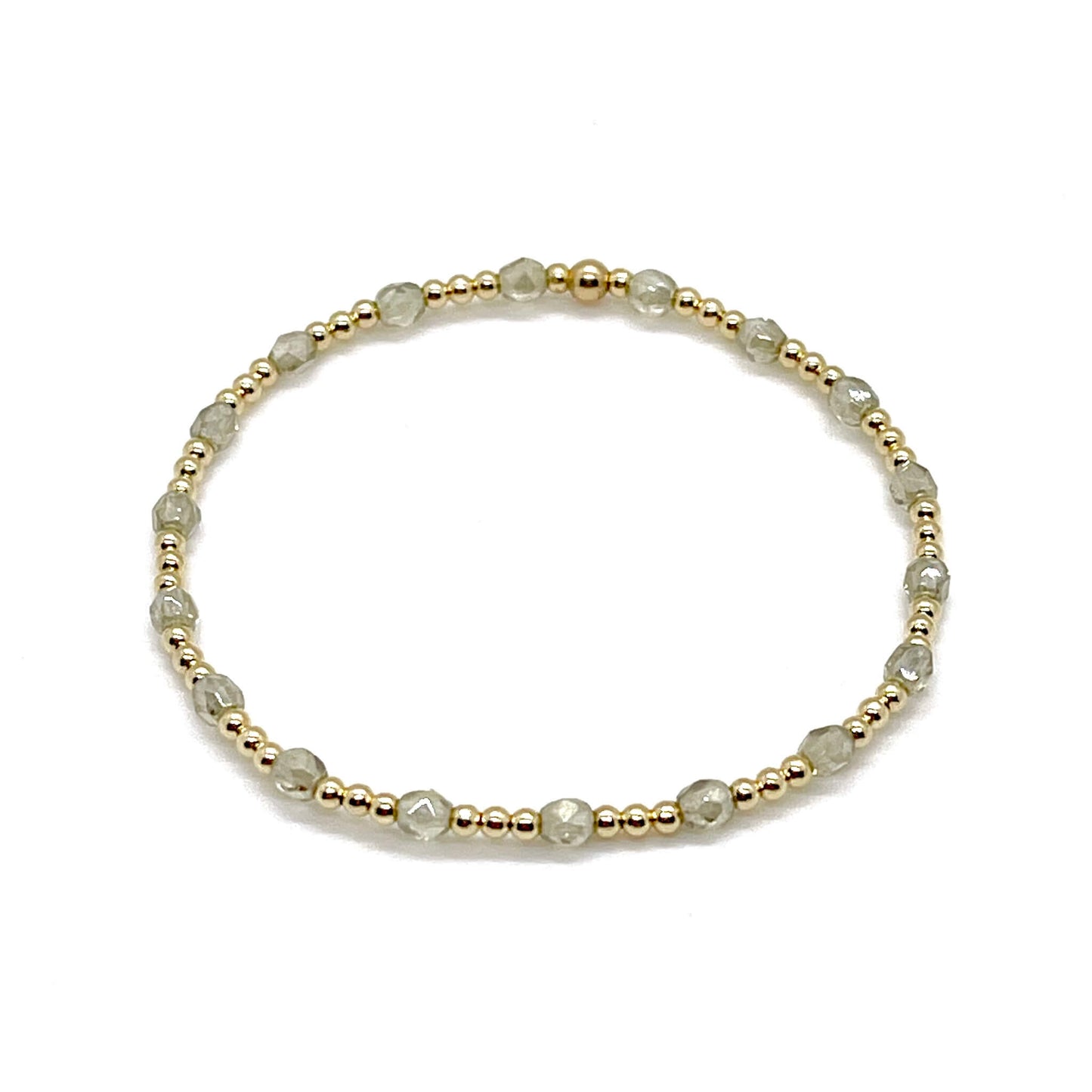 Grey-taupe crystal bracelet with small gold beads. Dainty womens stretch bracelet.