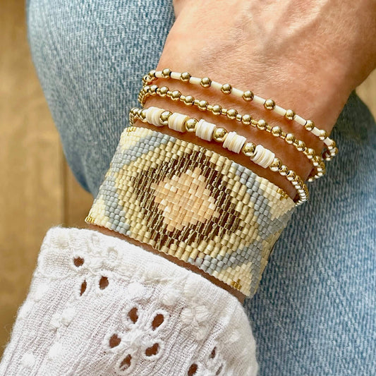 Soft summer shades of cream, tan,  gray, and gold seed bead woven and stretch bracelets.