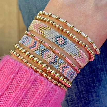 Gold Stretch Bracelets and Flat Beaded Bracelets. Bracelets Stacks & Singles with pastel seed beads.