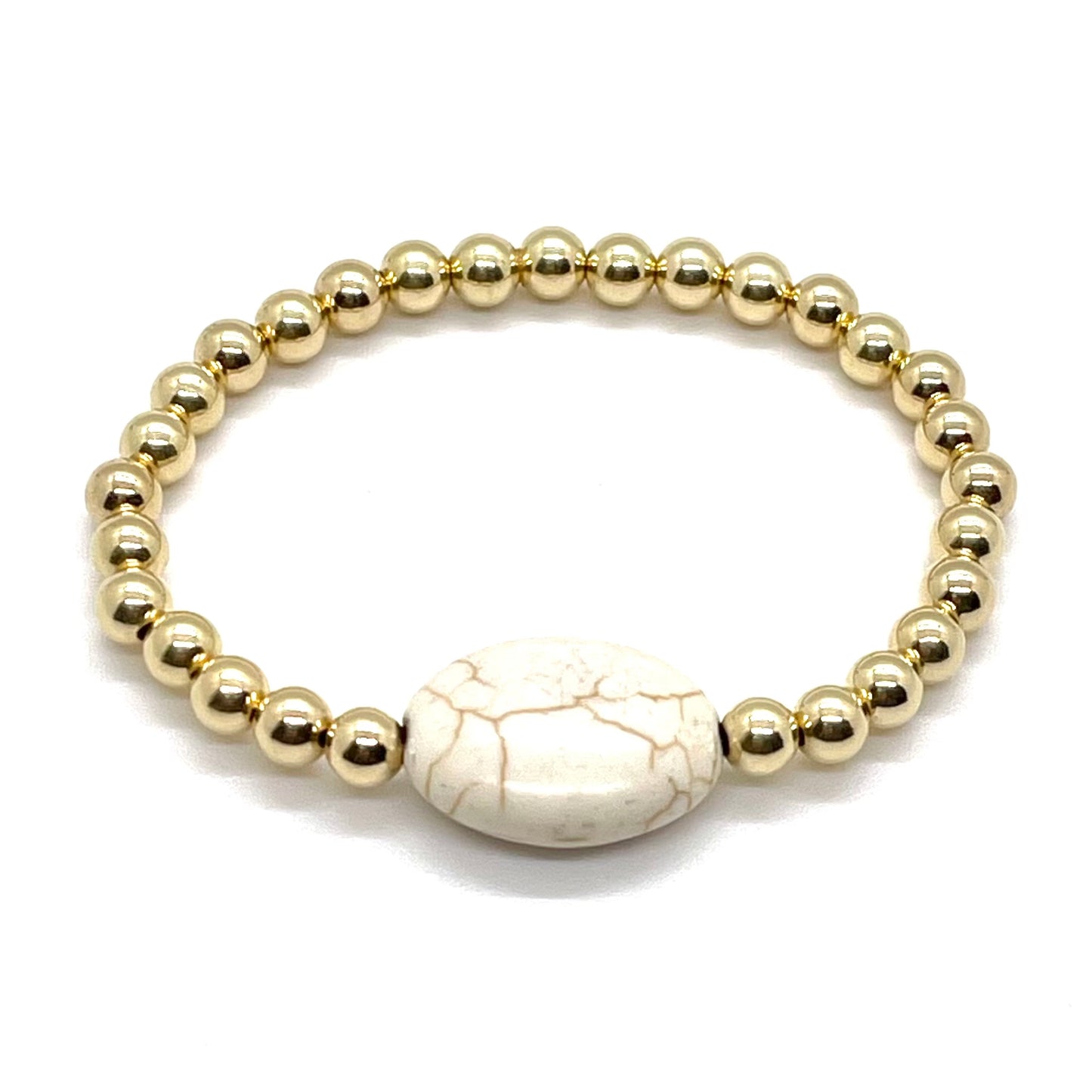 Magnesite bracelet with 5mm gold fill beads on elastic stretch.