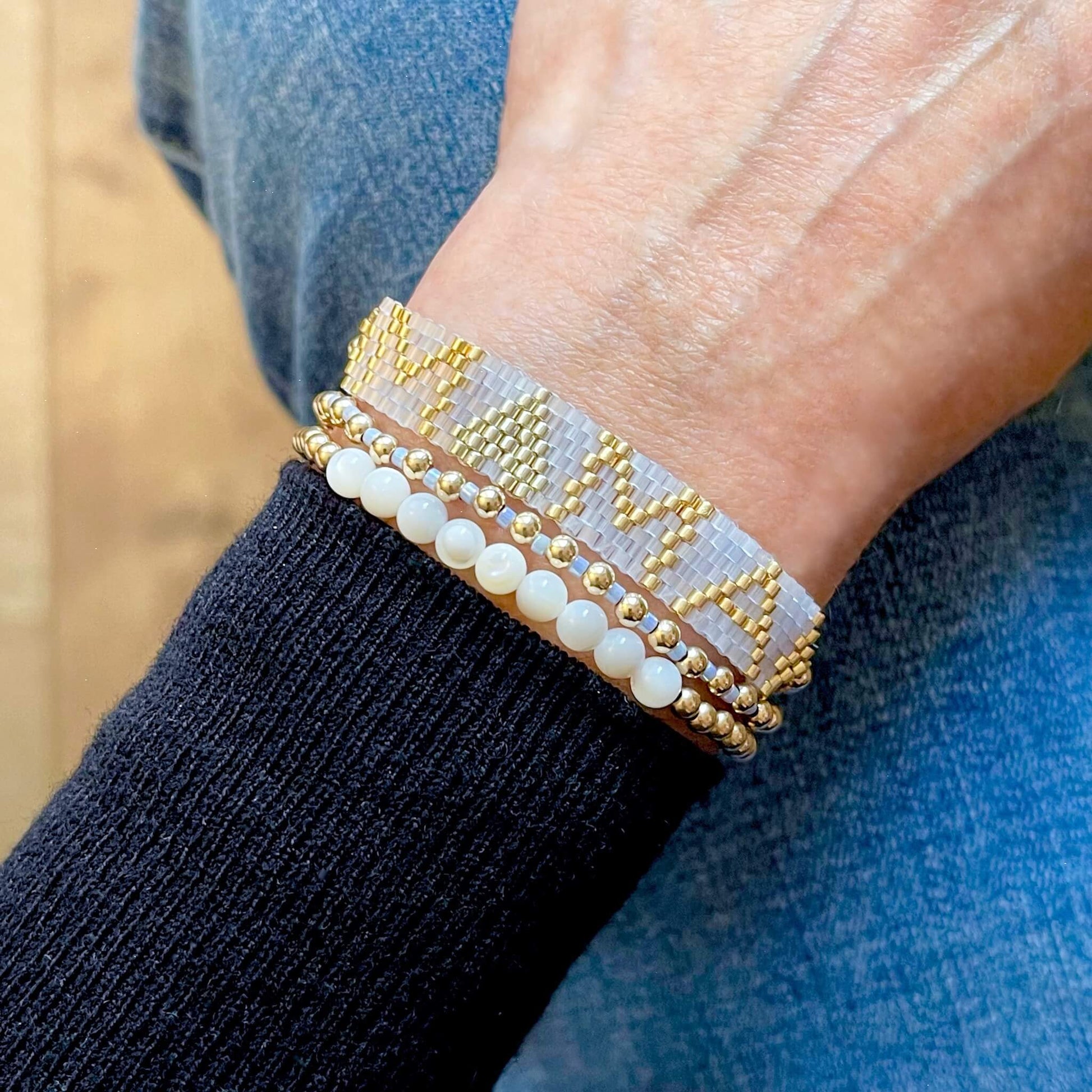 Mama beaded bracelet with blue and gold. Gold bead bracelet stack of 3 stretch bracelets with mother of pearl and gold beads.
