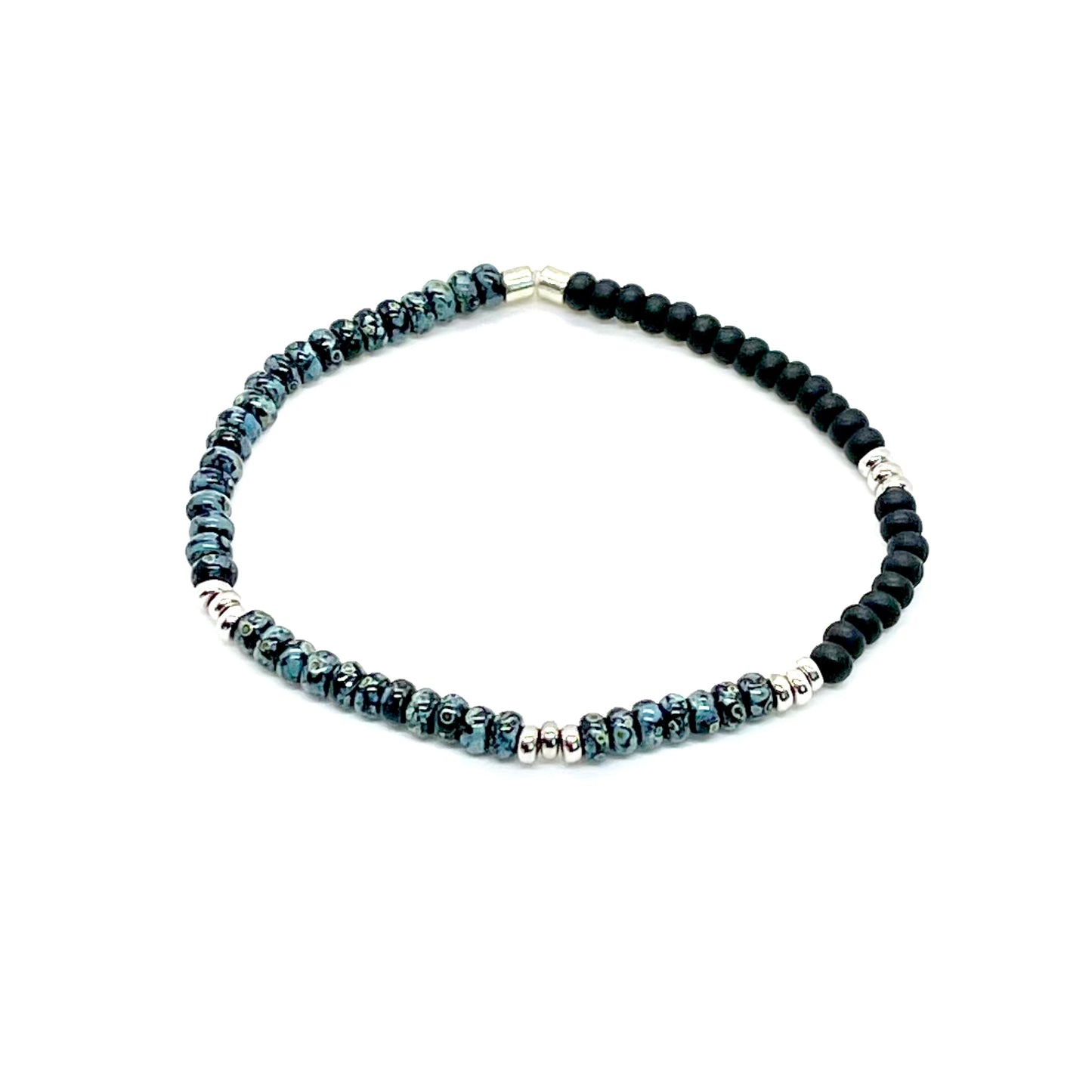 Men's blue speckled seed bead bracelet with black beads and silver accent disks on elastic stretch cord.