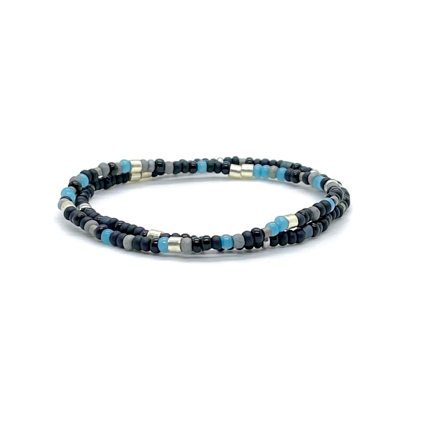 Men’s hand beaded boho stretch bracelets with black, gray, light blue, and silver tone seed beads.