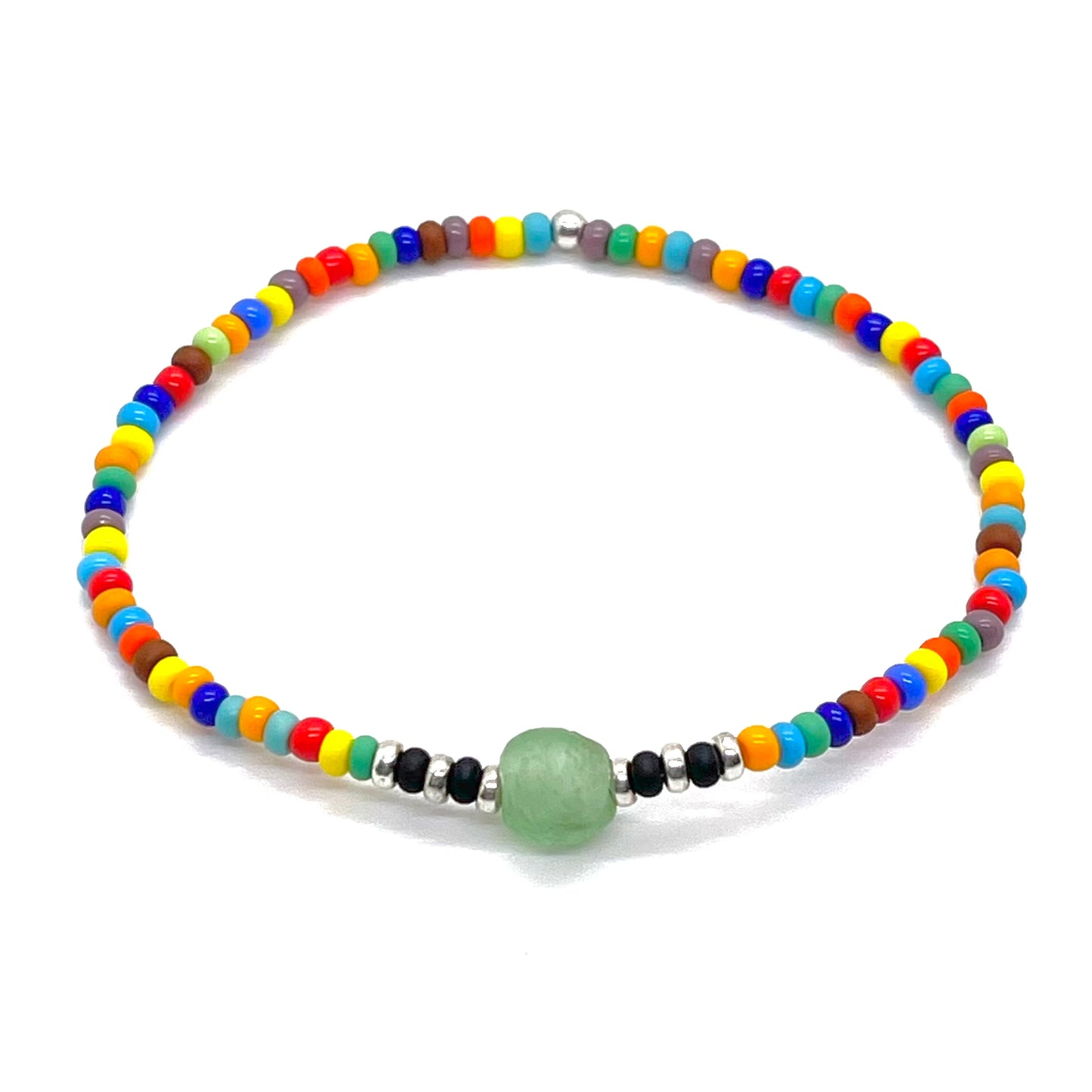 Men's beach bracelet with a mix of brightly colored beads and a green sea glass center bead surrounded by black and silver-tone beads.