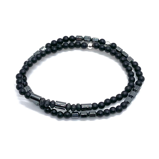 Mens black beaded bracelets with onyx, hematite, and black-plated pewter beads.