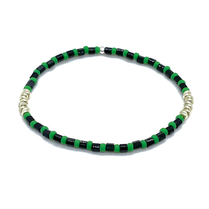 Mens black, green, and silver-tone bracelet with tube shaped and round glass seed beads on elastic stretch cord.
