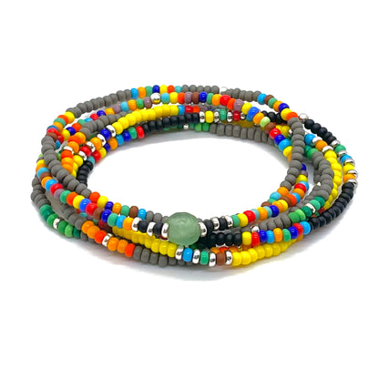 Men's bracelet stack in assorted colors with contrasting black, yellow and gray seed beads. Stretchy and waterproof.