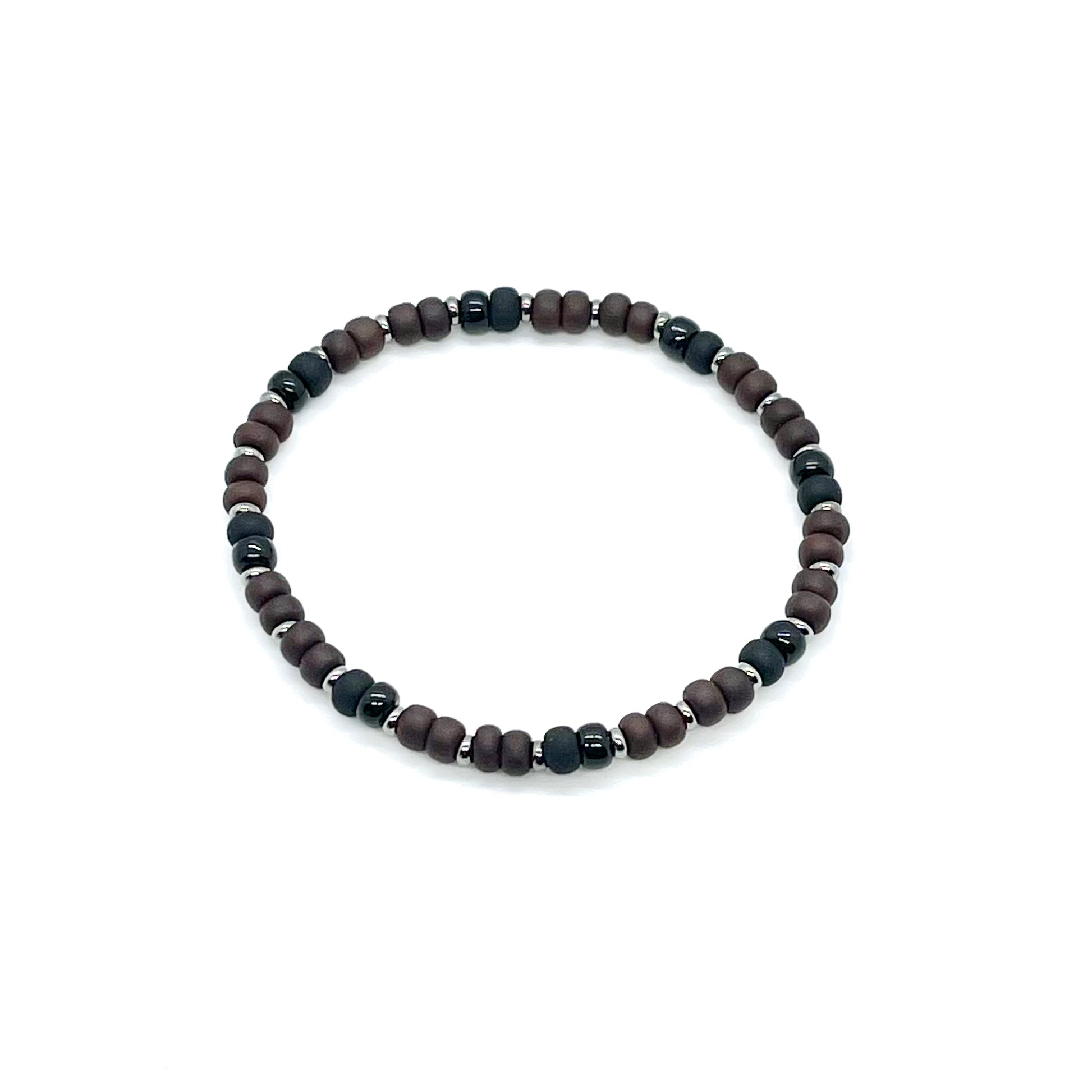 Men's brown beaded bracelet with alternating black seed beads and silver-tone accent disks on elastic stretch cord.