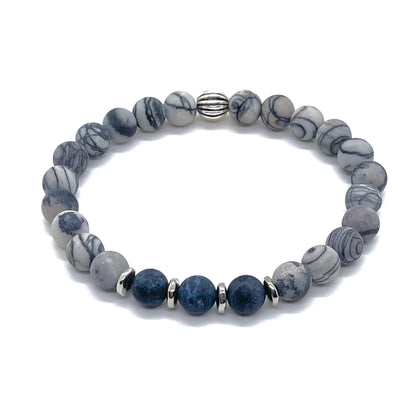 Mens gemstone bracelet with matte black and white silk stone and blue dumortierite and silver on stretch cord.