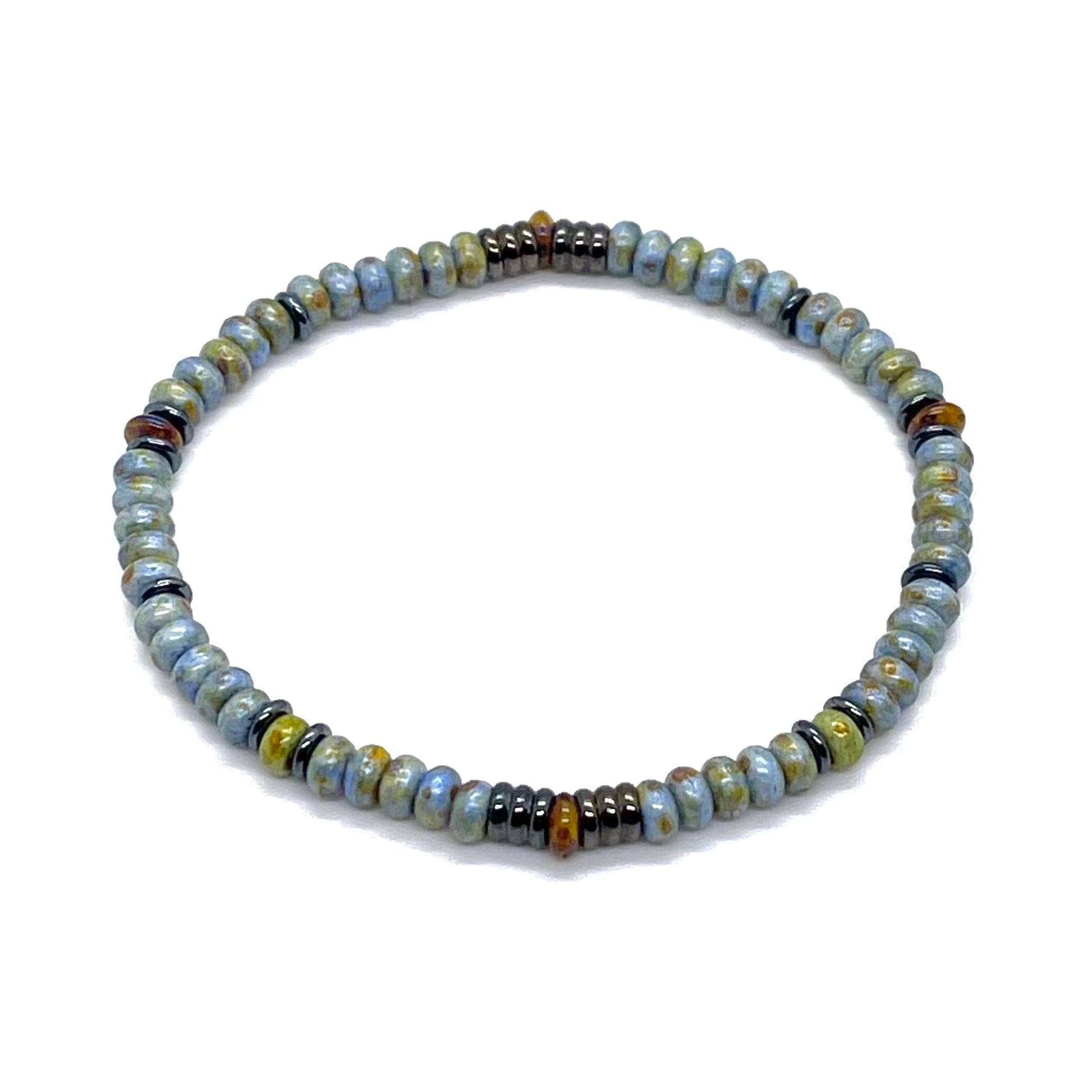 Mens speckled seed bead bracelet with blue, green, and brown beads and gunmetal accents on elastic stretch cord.