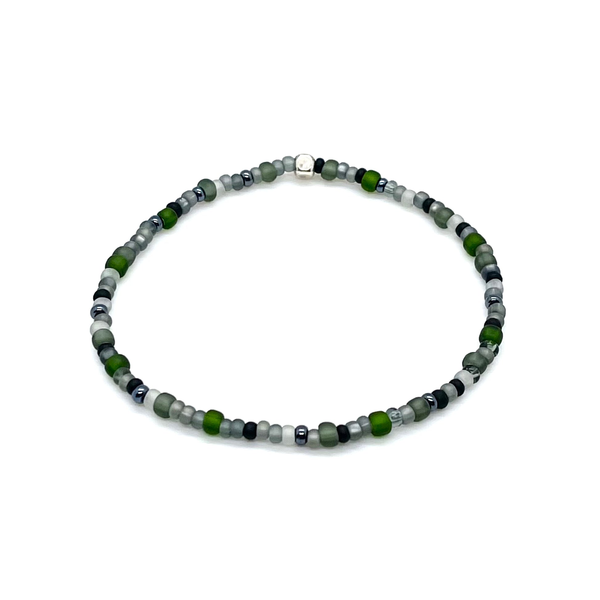 Men's thin bracelet with green and gray seed beads on elastic stretch cord.